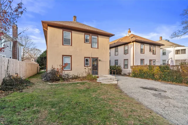 a view of a car parked in front of a house