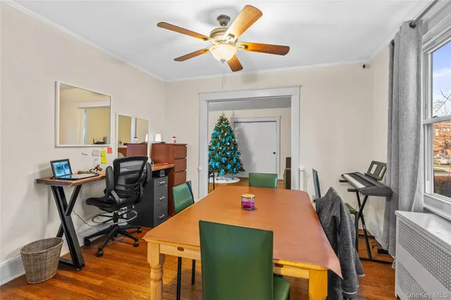 a dining room with furniture and window