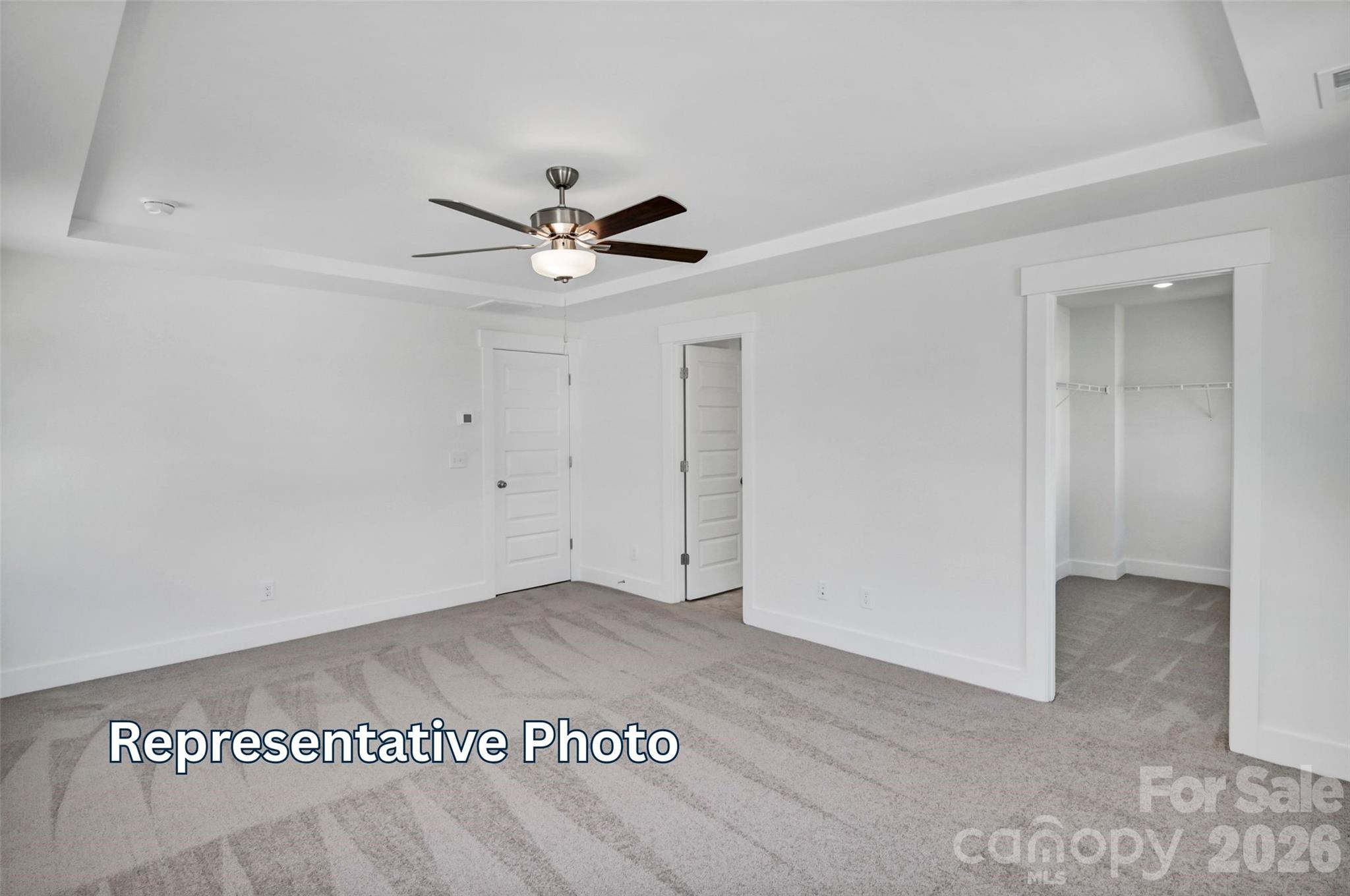 13115 Foxberry Road Charlotte, NC 28213 - Photo 14 of 20 an empty room with a ceiling fan and a window