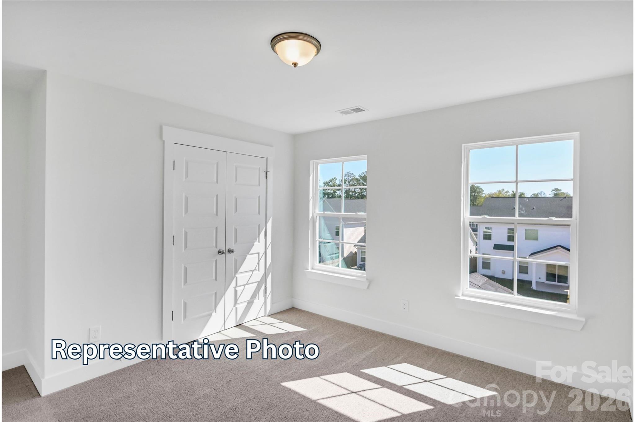 13115 Foxberry Road Charlotte, NC 28213 - Photo 20 of 20 a view of an empty room with a window