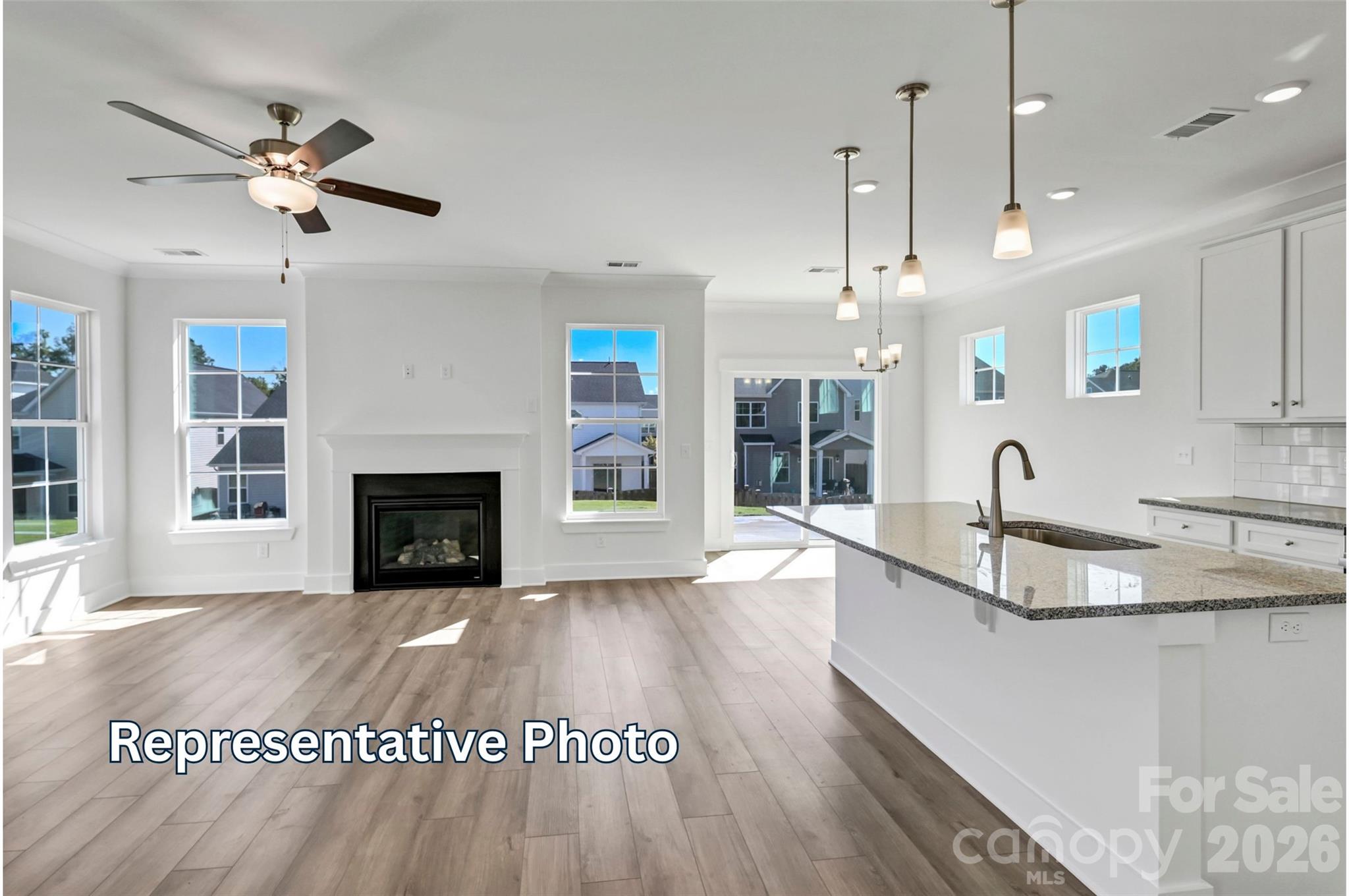 13115 Foxberry Road Charlotte, NC 28213 - Photo 3 of 20 a view of a kitchen with a sink and a fireplace