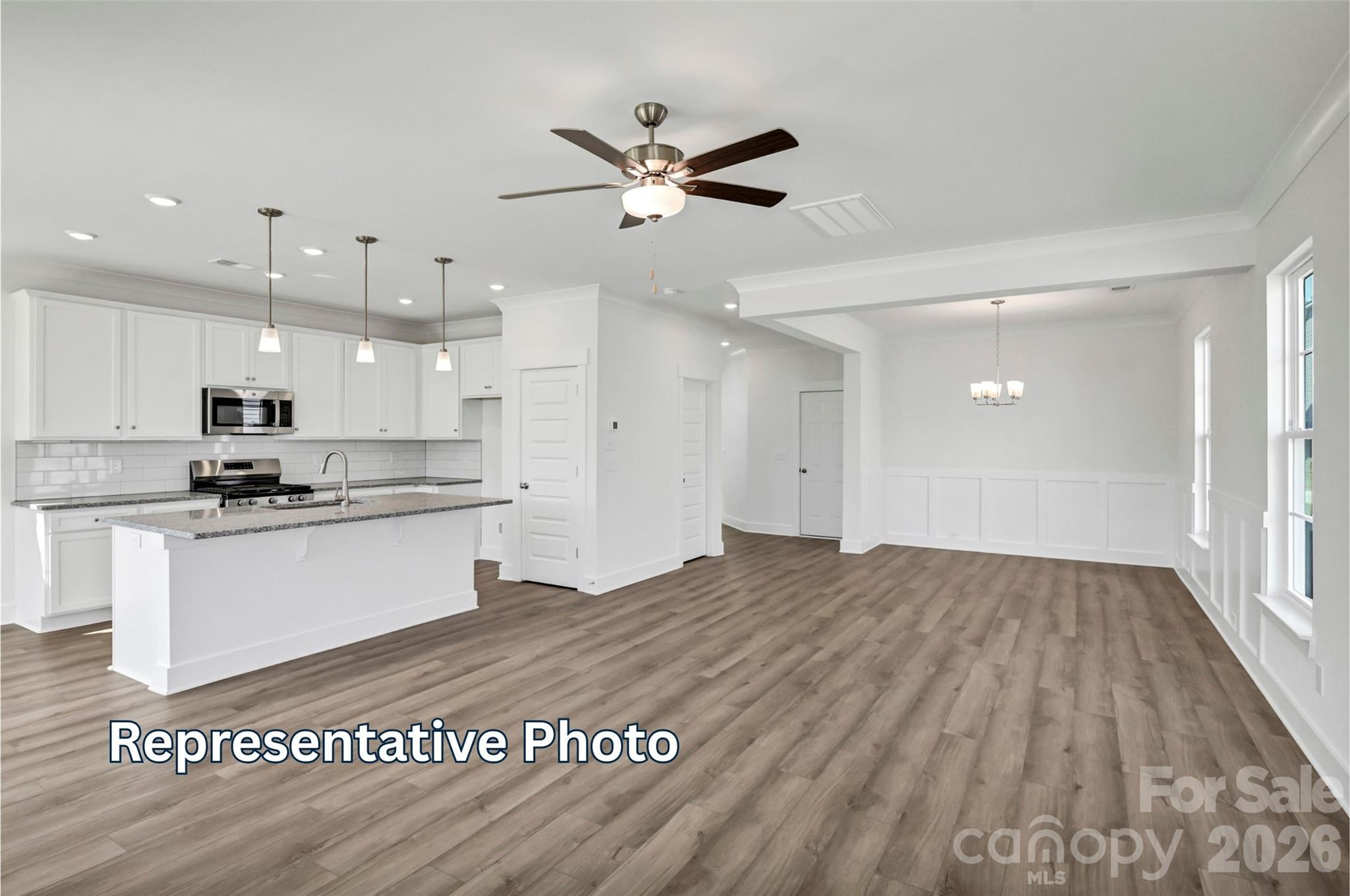 13115 Foxberry Road Charlotte, NC 28213 - Photo 8 of 20 a view of kitchen with stainless steel appliances granite countertop cabinets and wooden floor