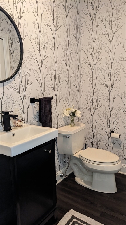 53 Baldwin Road, Unit 201 Billerica, MA 01821 - Photo 12 of 35 a bathroom with a toilet sink and mirror