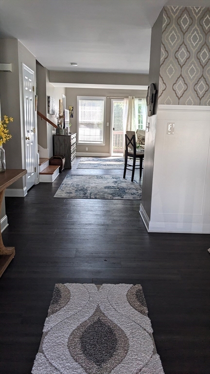 53 Baldwin Road, Unit 201 Billerica, MA 01821 - Photo 13 of 35 a living room with furniture and a wooden floor