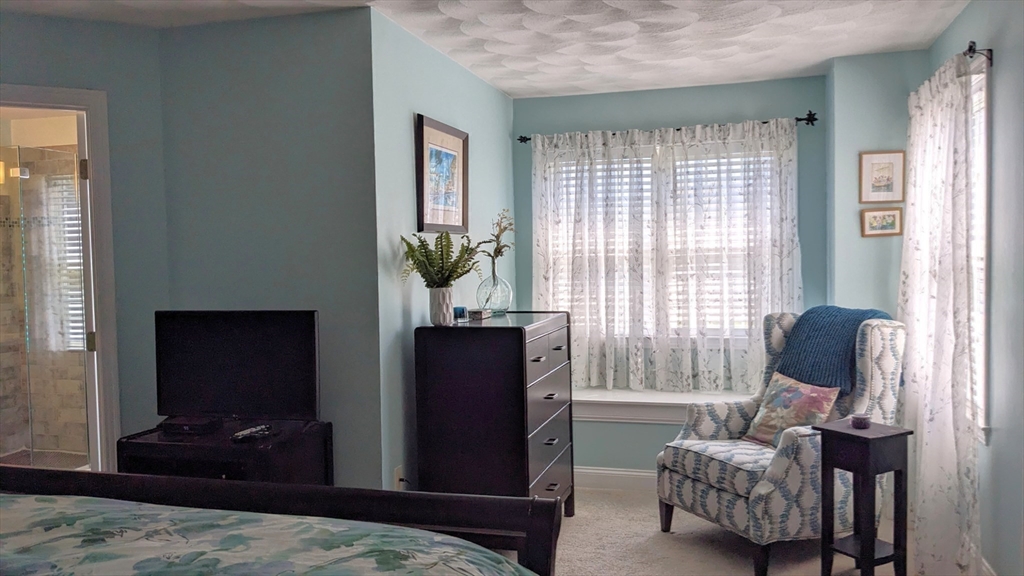 53 Baldwin Road, Unit 201 Billerica, MA 01821 - Photo 15 of 35 a bedroom with furniture and windows