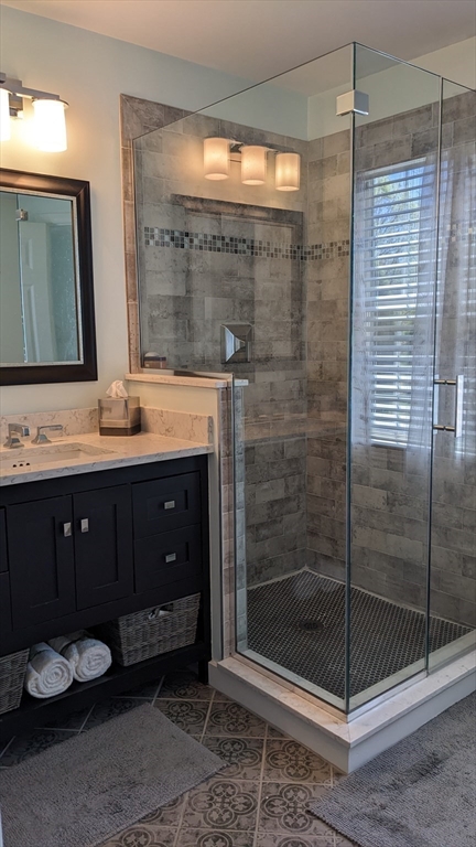 53 Baldwin Road, Unit 201 Billerica, MA 01821 - Photo 17 of 35 a bathroom with a sink and a mirror