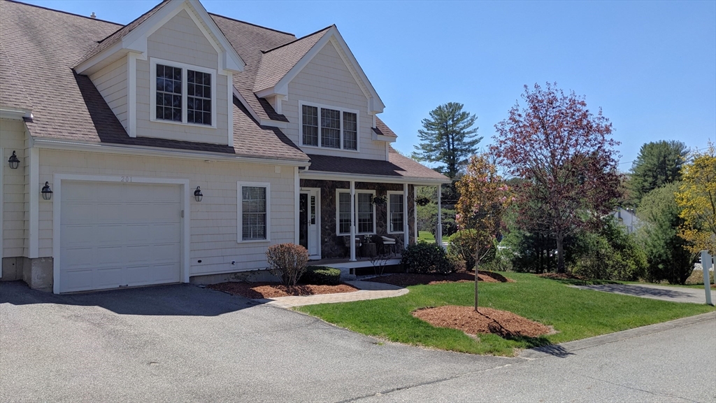 53 Baldwin Road, Unit 201 Billerica, MA 01821 - Photo 2 of 35 front view of house with a yard