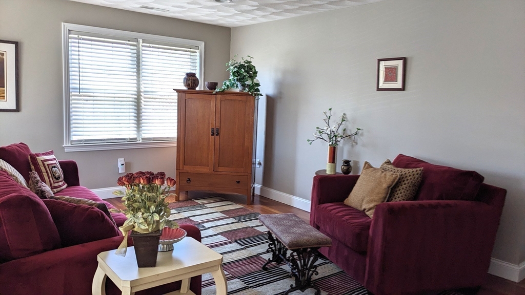 53 Baldwin Road, Unit 201 Billerica, MA 01821 - Photo 21 of 35 a living room with furniture and a potted plant
