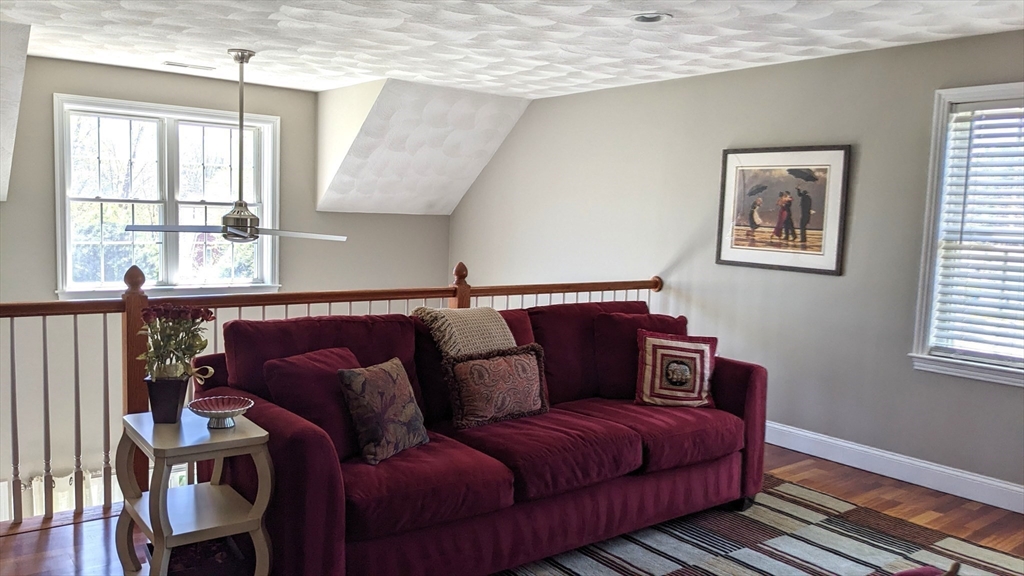 53 Baldwin Road, Unit 201 Billerica, MA 01821 - Photo 22 of 35 a living room with furniture a window and wooden floor