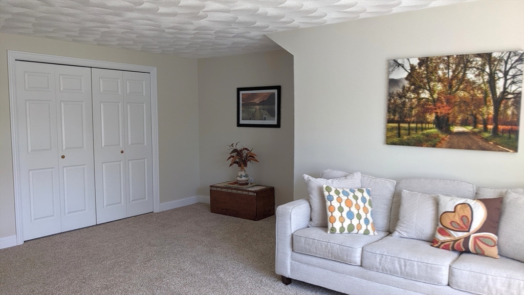53 Baldwin Road, Unit 201 Billerica, MA 01821 - Photo 25 of 35 a living room with furniture