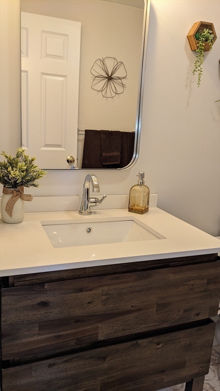 53 Baldwin Road, Unit 201 Billerica, MA 01821 - Photo 27 of 35 a bathroom with a sink and a mirror
