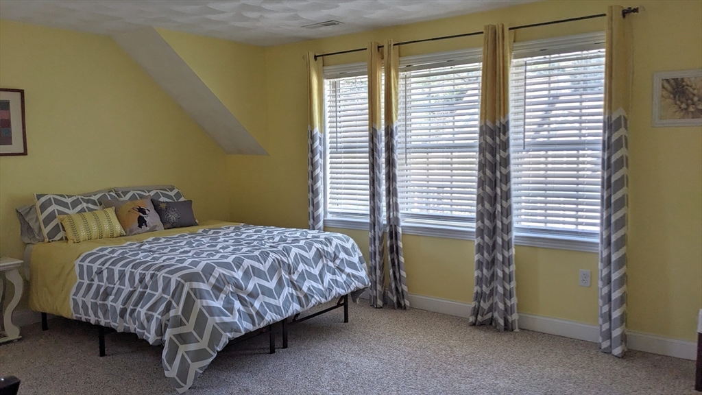 53 Baldwin Road, Unit 201 Billerica, MA 01821 - Photo 29 of 35 a bedroom with a bed and a window