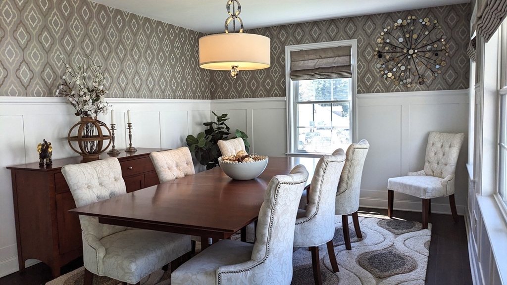 53 Baldwin Road, Unit 201 Billerica, MA 01821 - Photo 3 of 35 a view of a dining room with furniture wooden floor and chandelier