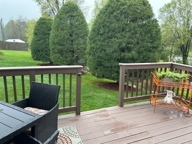 53 Baldwin Road, Unit 201 Billerica, MA 01821 - Photo 35 of 35 a view of a deck with wooden floor and fence