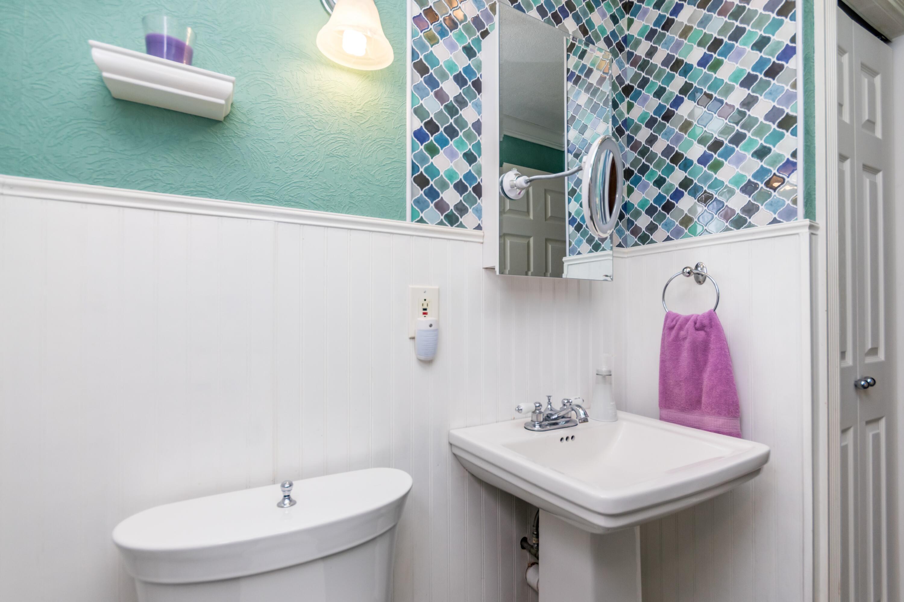 58 Maple Street Buzzards Bay, MA 02532 - Photo 15 of 29 a bathroom with a sink and mirror with toilet