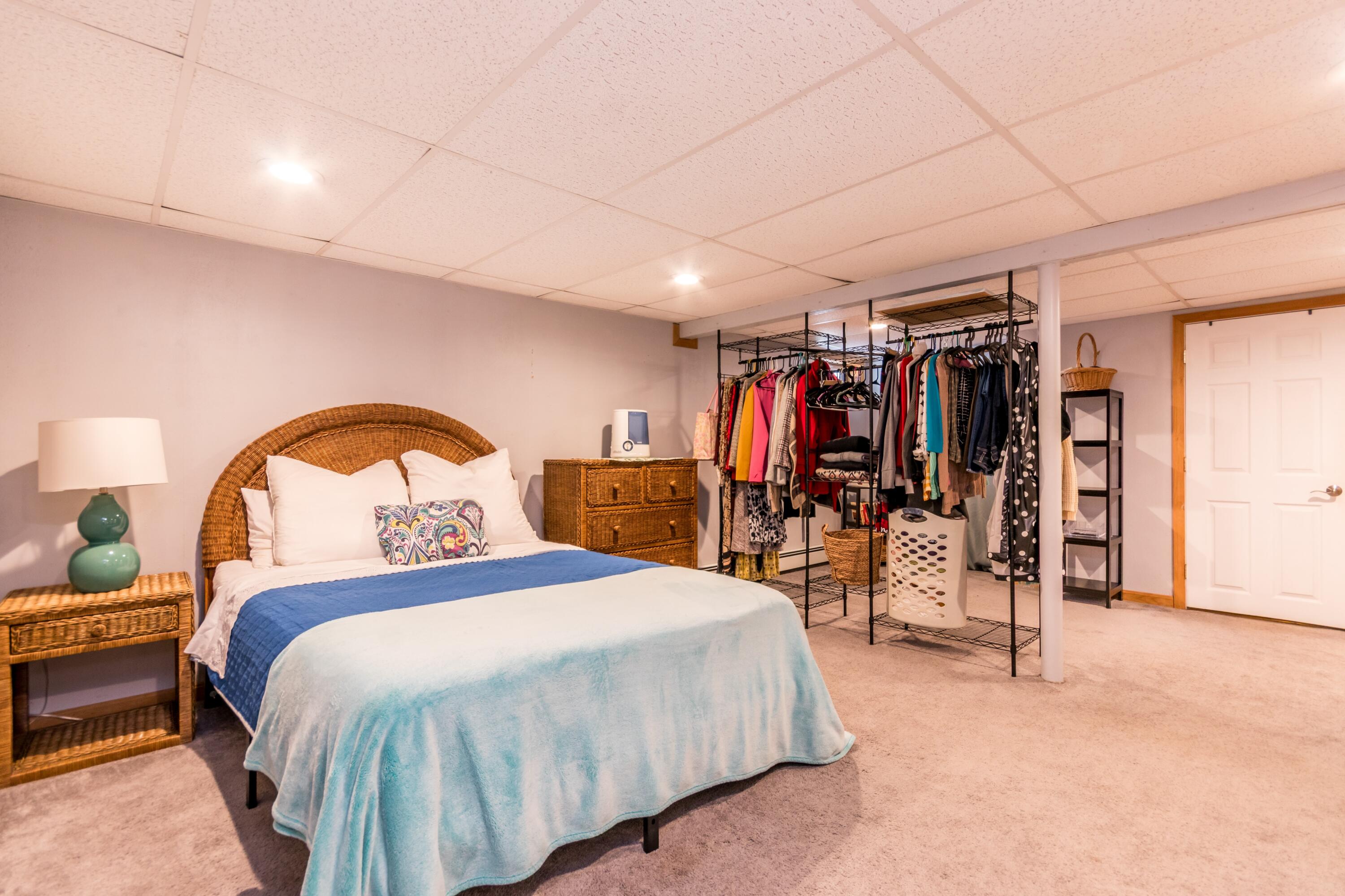 58 Maple Street Buzzards Bay, MA 02532 - Photo 18 of 29 a bedroom with a bed and a gym machine