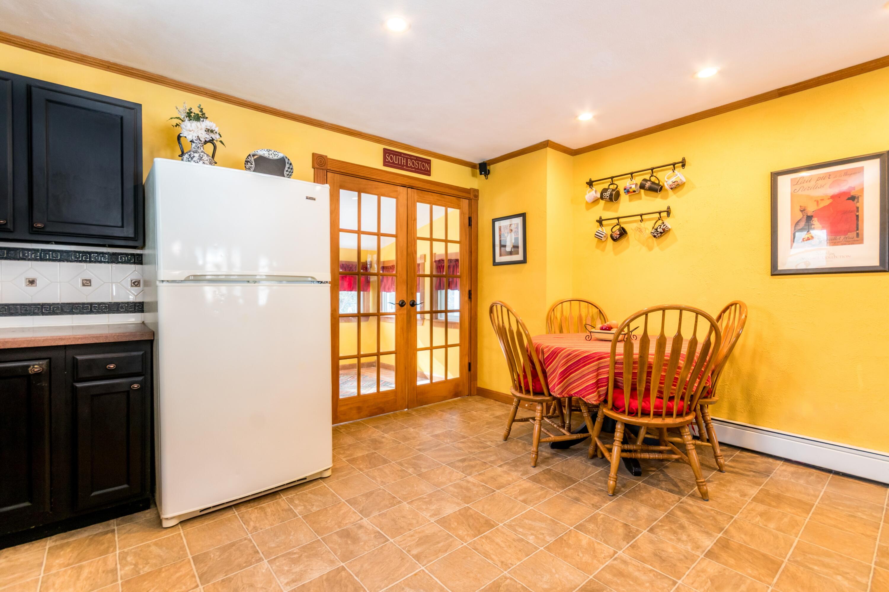 58 Maple Street Buzzards Bay, MA 02532 - Photo 6 of 29 a view of kitchen with furniture and a refrigerator