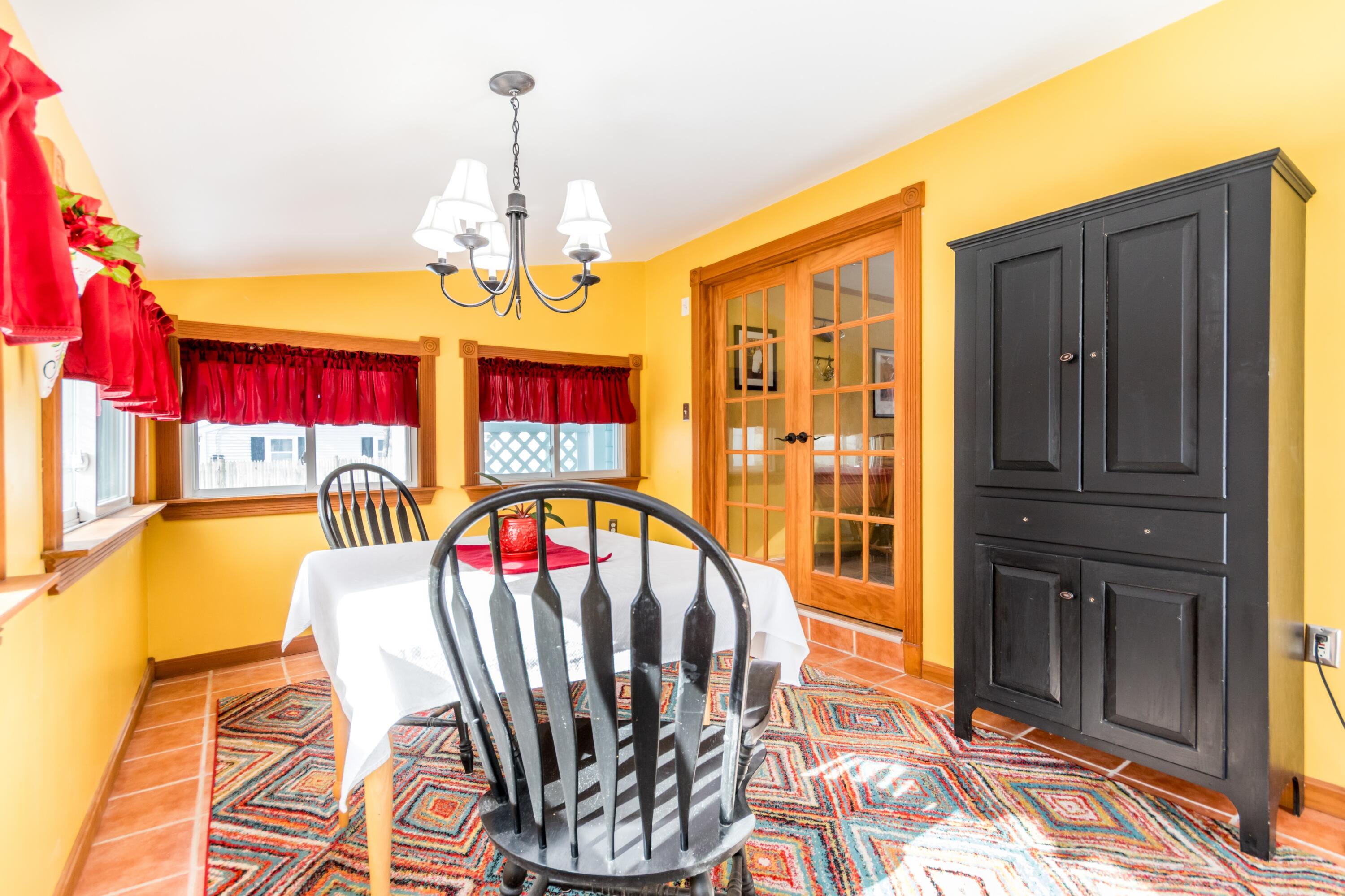 58 Maple Street Buzzards Bay, MA 02532 - Photo 9 of 29 a view of entryway dining room and hall with wooden floor