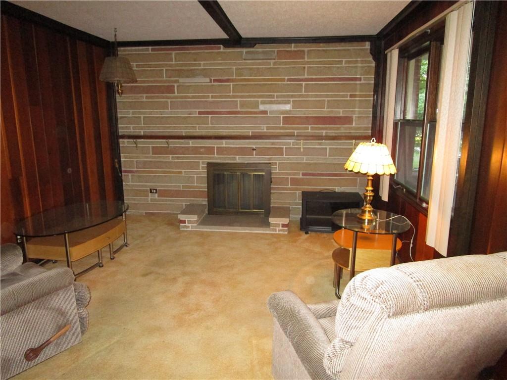 3330 Hubbard-Middlesex Road West Middlesex, PA 16159 - Photo 3 of 21 a living room with furniture and a fireplace