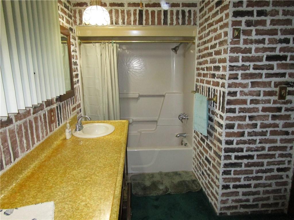 3330 Hubbard-Middlesex Road West Middlesex, PA 16159 - Photo 8 of 21 a bathroom with a granite countertop shower and a sink