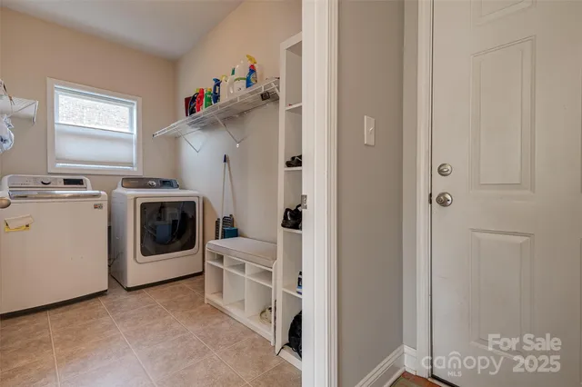a view of a kitchen with washer and dryer