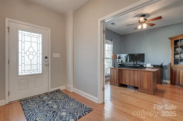 a view of kitchen with sink and wooden floor