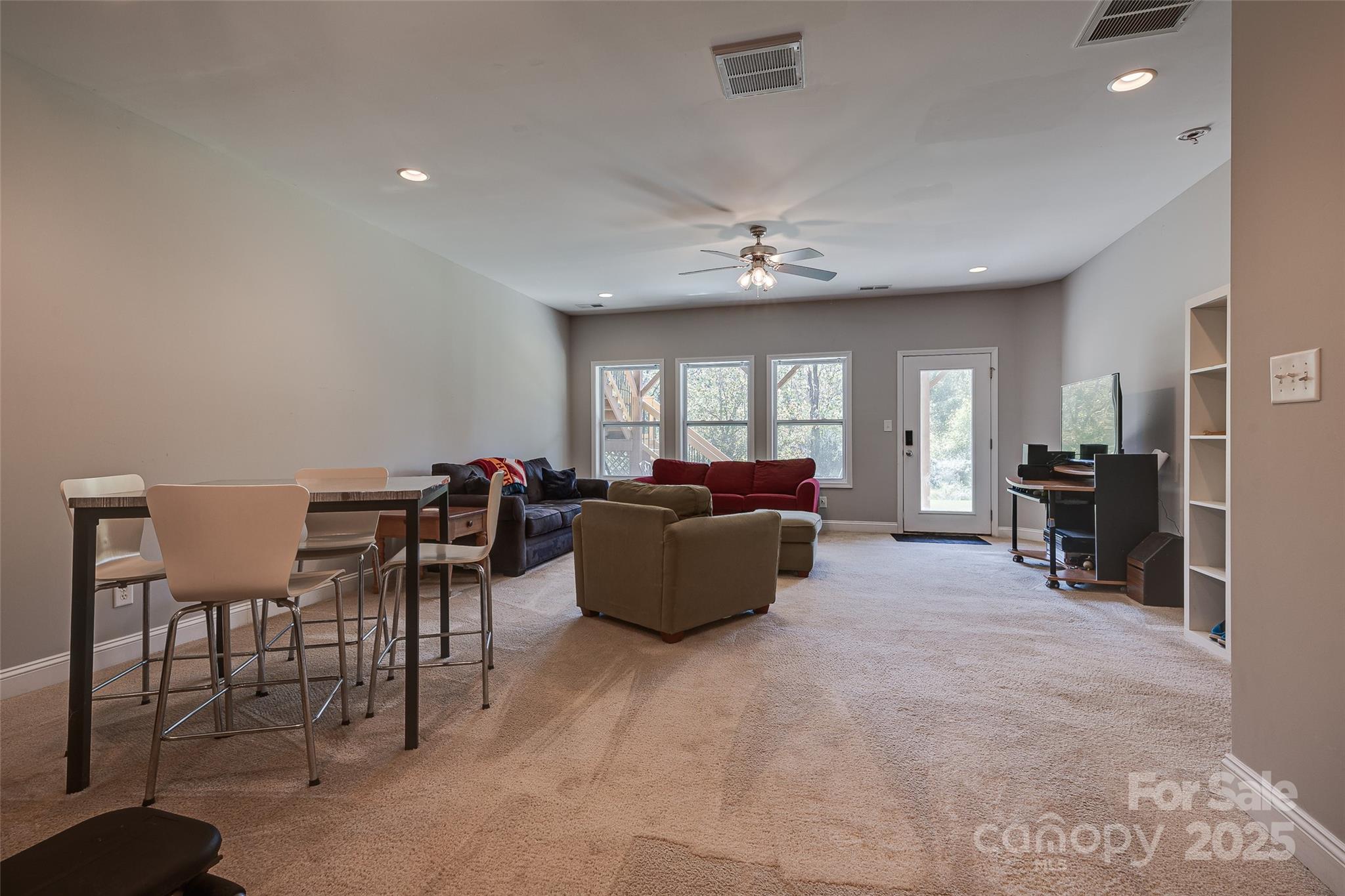 1266 Lange Court Fort Mill, SC 29715 - Photo 27 of 45 a living room with furniture and a chandelier