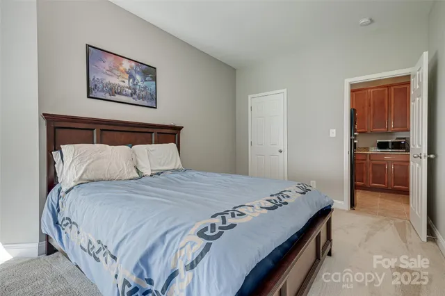 a bedroom with bed and window