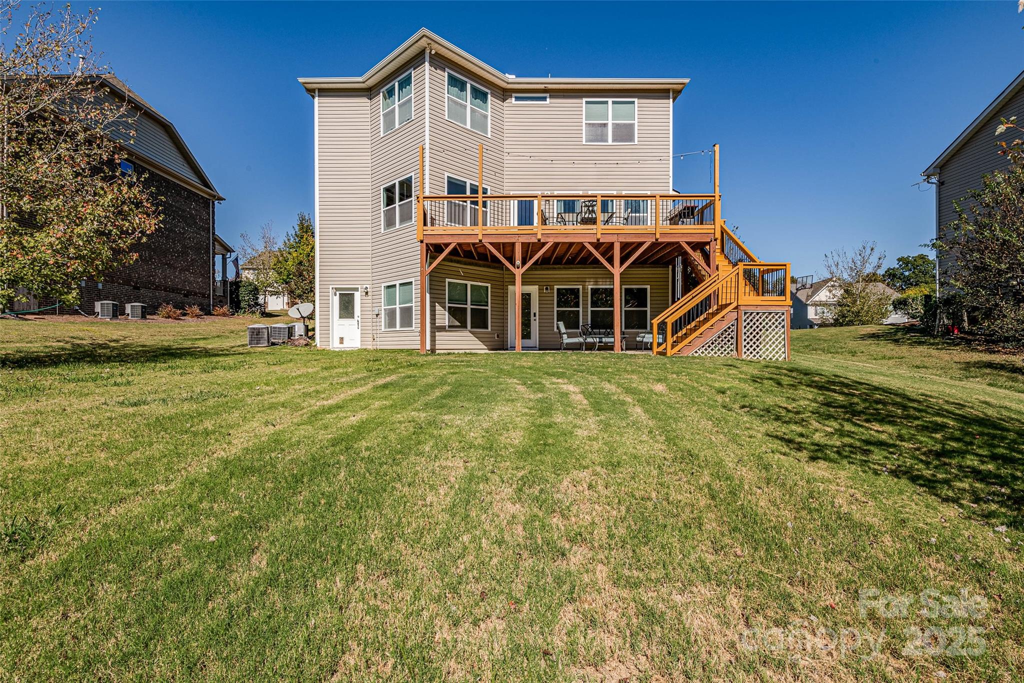 1266 Lange Court Fort Mill, SC 29715 - Photo 41 of 45 a view of a house with a big yard and large trees