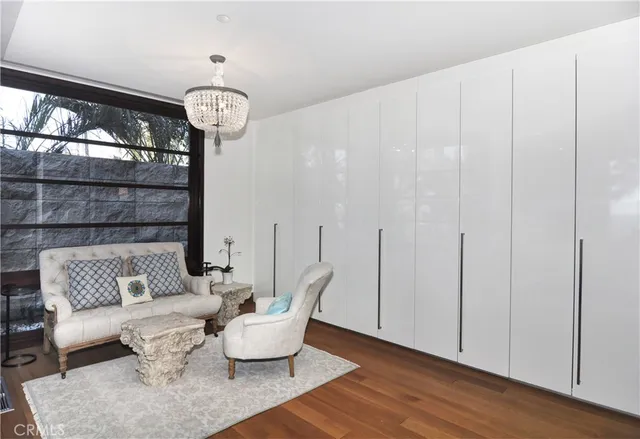 a bedroom with a bed and a lamp