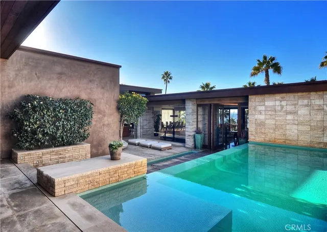 a view of an house with backyard porch and entertaining space