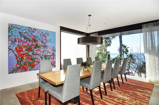 a dinning area with a table and chairs