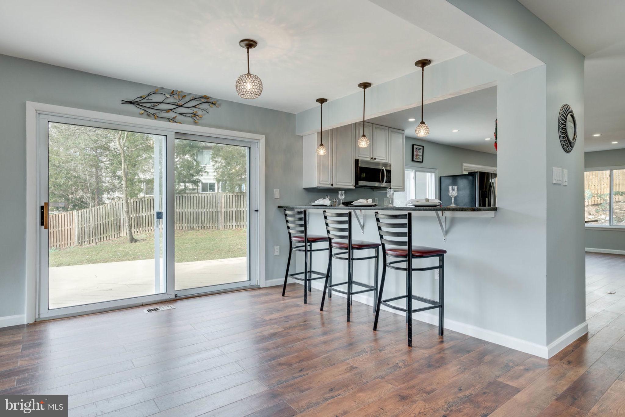 7627 Mineral Spring Court Springfield, VA 22153 - Photo 22 of 34 a view of a kitchen with microwave and furniture