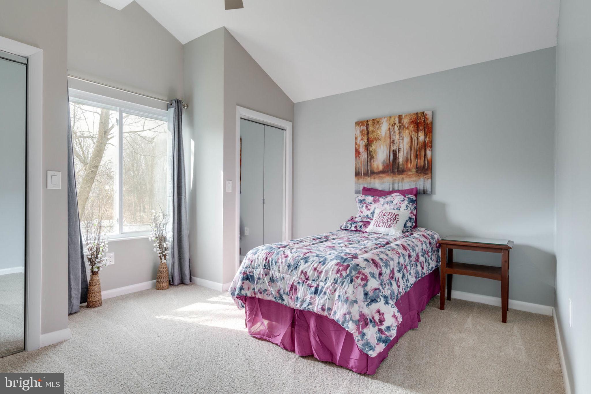 7627 Mineral Spring Court Springfield, VA 22153 - Photo 8 of 34 a bedroom with a bed and a painting on the wall