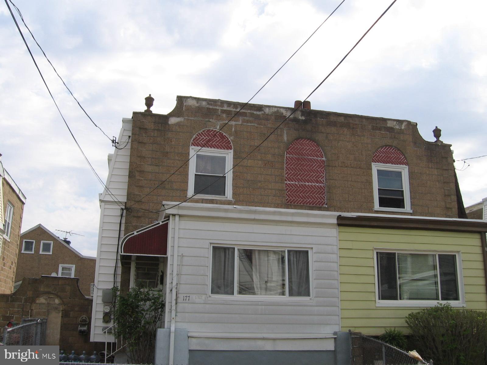 177 Wellington Road Upper Darby, PA 19082 - Photo 2 of 20 a brick building with a large windows