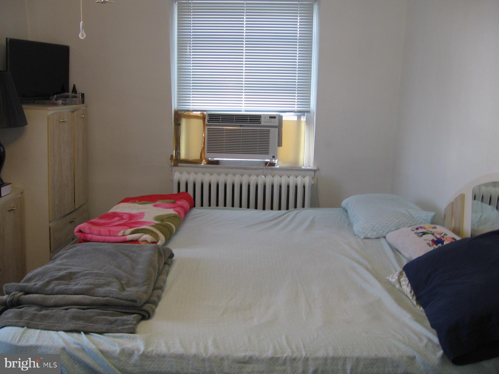 177 Wellington Road Upper Darby, PA 19082 - Photo 12 of 20 a bedroom with a bed and flat screen tv