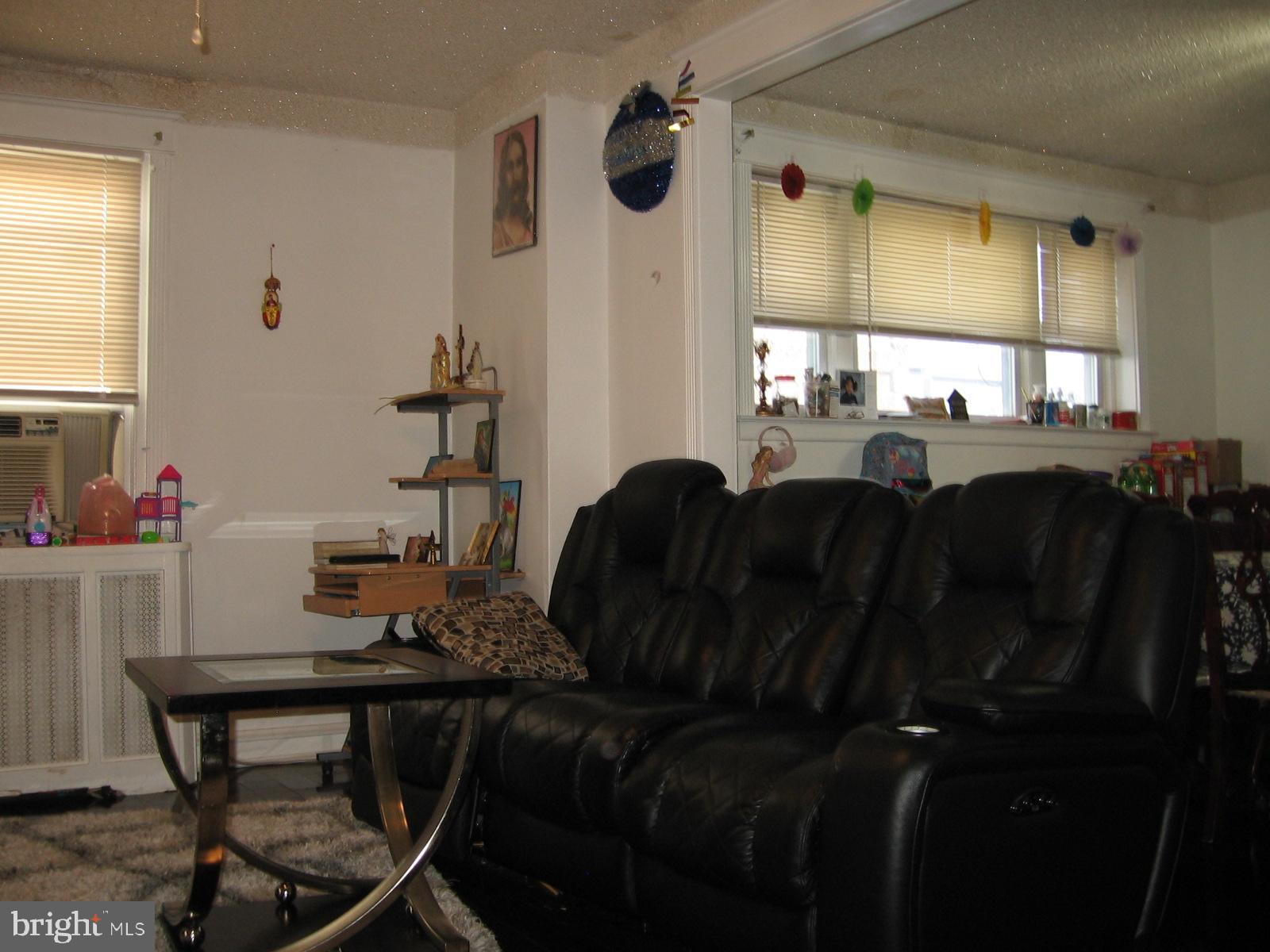 177 Wellington Road Upper Darby, PA 19082 - Photo 17 of 20 a living room with furniture and a window