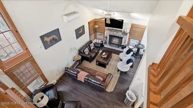 a view of living room with furniture and flat screen tv
