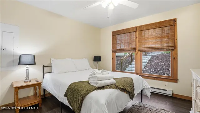 a bedroom with a bed and a lamp