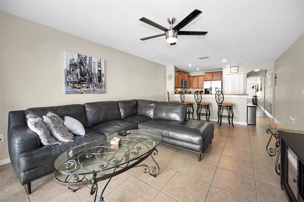 9736 Trumpet Vine Loop Trinity, FL 34655 - Photo 10 of 35 a living room with furniture and kitchen view