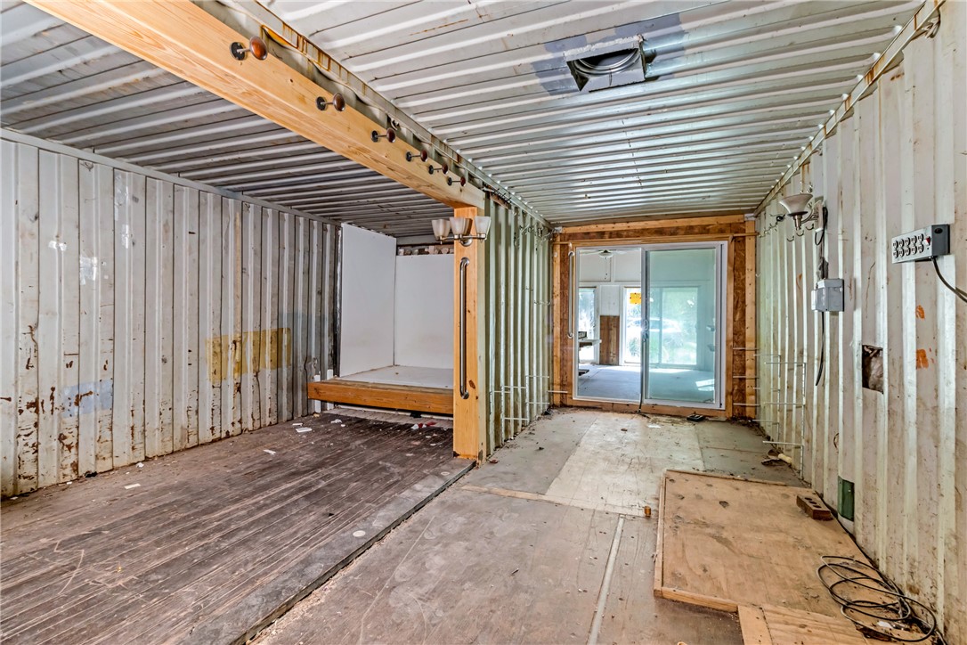 2312 Old Pendleton Road Easley, SC 29642 - Photo 11 of 16 This unique interior space showcases raw industrial design with exposed corrugated metal walls and sliding glass doors.