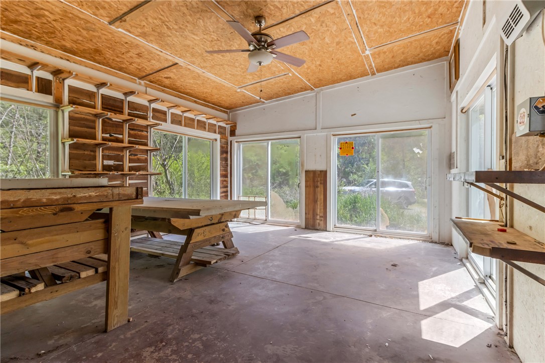 2312 Old Pendleton Road Easley, SC 29642 - Photo 12 of 16 This spacious sunroom features ample natural light and a rustic wood aesthetic, ideal for various uses.