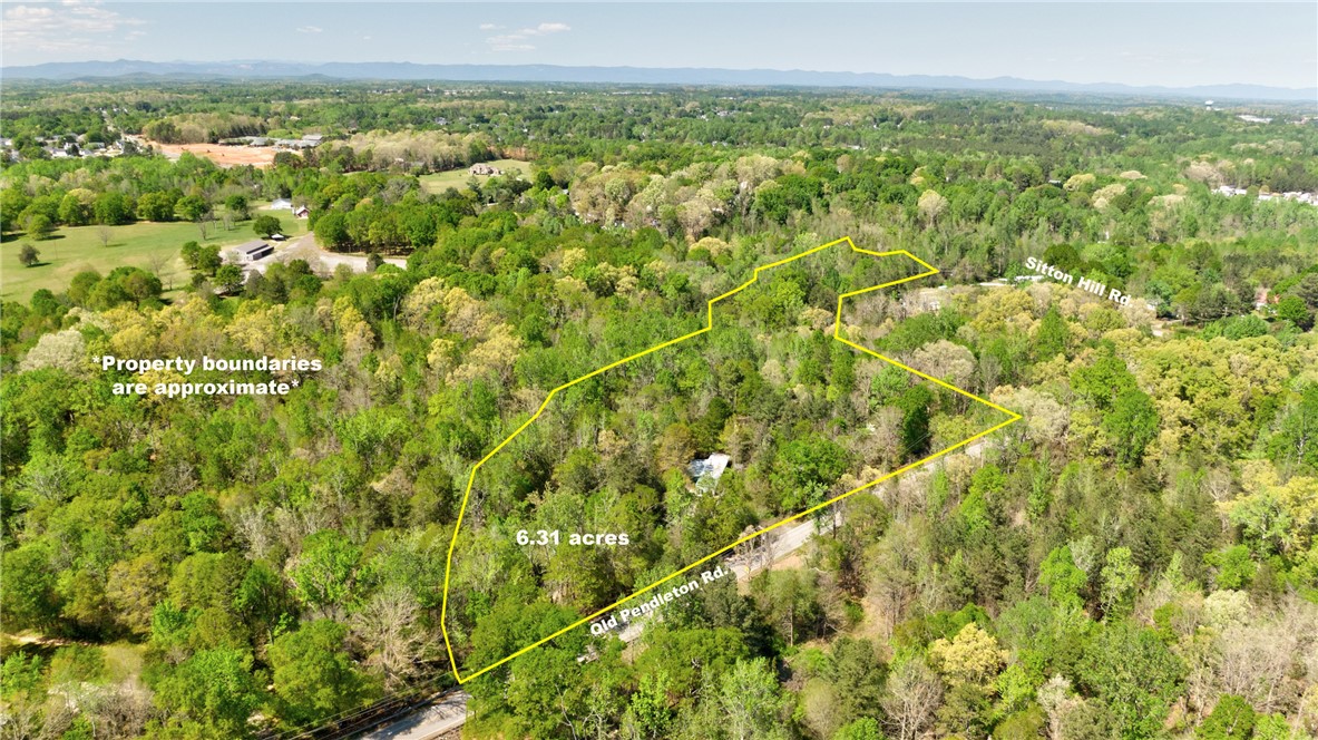 2312 Old Pendleton Road Easley, SC 29642 - Photo 2 of 16 Sprawling forested acreage offers a tranquil retreat with ample space for custom development.