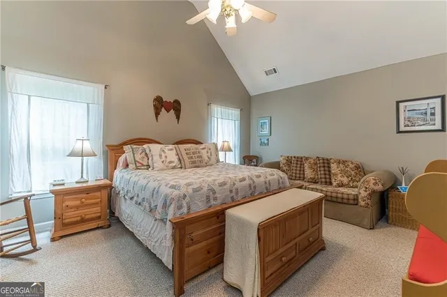 a bathroom with a sink a tub and a mirror
