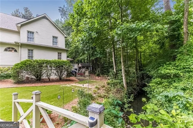 a view of a patio with a table and chairs