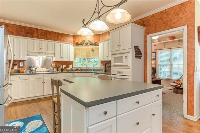 a living room with furniture rug and window