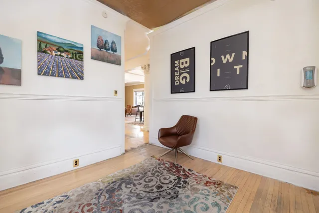 a living room with furniture and a rug