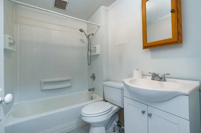 a bathroom with a sink a toilet and a bathtub