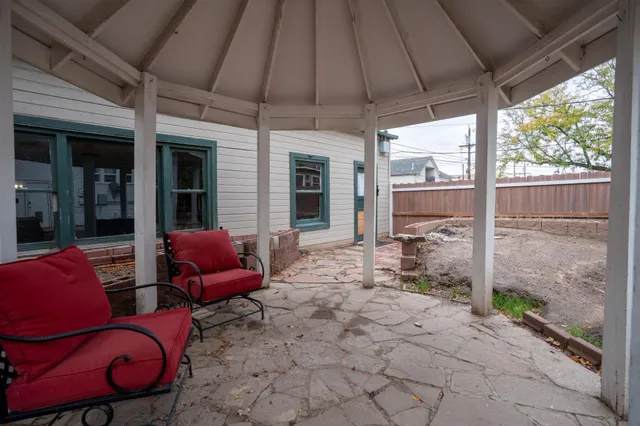 a backyard of a house with seating space