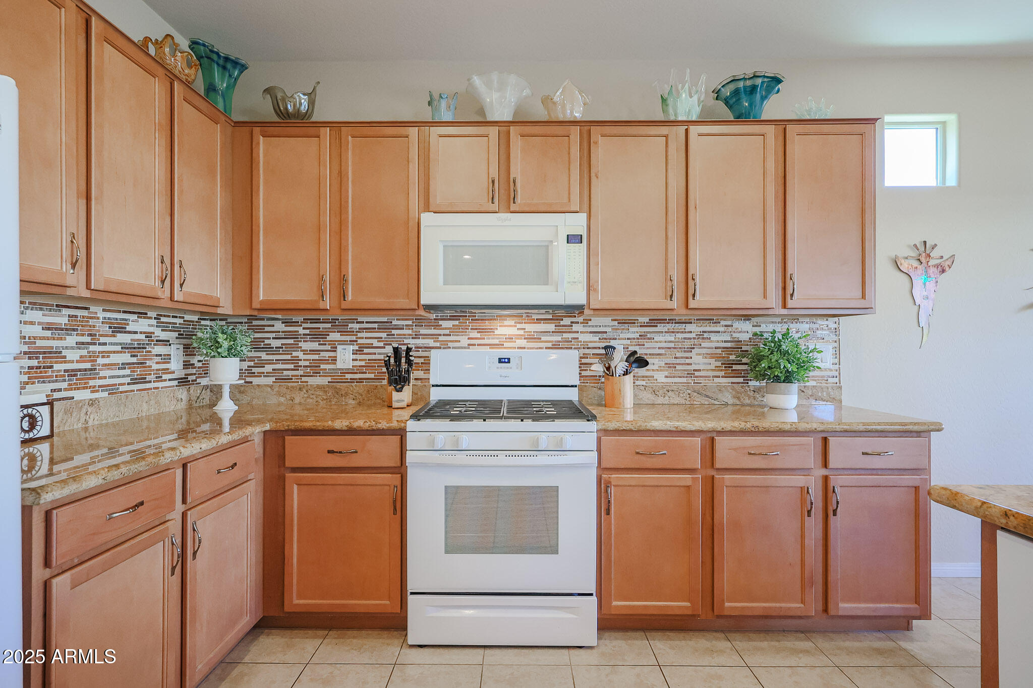 17574 West Nighthawk Way Goodyear, AZ 85338 - Photo 6 of 58 Warm and Bright Kitchen
